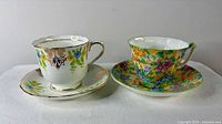Front view of both teacup and saucer sets