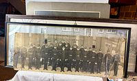 Framed police group photo showing damage lower right