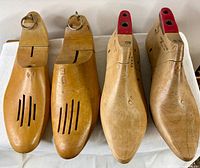 Four wooden shoe lasts front view
