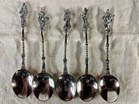 Front view of all five apostle spoons