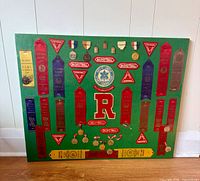 Large green felt board with ribbons, medals, R patch