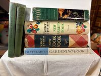 Group shot of all six books standing and stacked