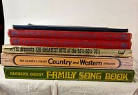 Stack showing spines of all six music books