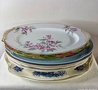 Stack of eight platters showing variety of colours, patterns and sizes