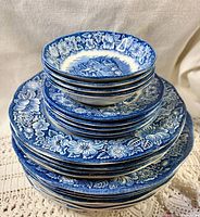 Stacked view showing all Liberty Blue plates and bowls