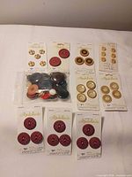 All button cards and bag laid out on surface