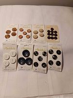 All eight button cards laid out