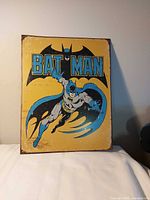 Front view of Batman metal sign showing graphic and wear