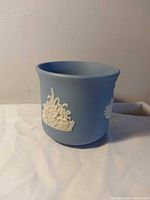 Full view of blue planter showing relief design