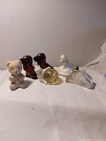 Group view showing all six Avon animal-shaped perfume bottles