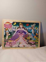 Front view of the wooden 24-piece puzzle showing full artwork and frame