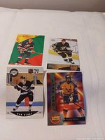 Fronts of four hockey rookie cards laid out