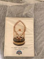 Front cover showing trophy image and title