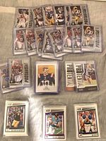 Top-loaded 2022 Score "Potential" rookie inserts and stacks of sleeved base cards on table