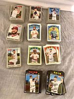 Stacks of Topps Heritage baseball cards sorted in piles