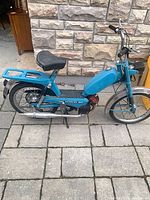 Left side view of blue Batavus moped