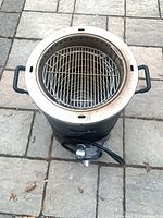 Top view showing interior cooking basket and grate of Char-Broil The Big Easy roaster