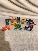 Front view of all ten Hasbro transforming puzzle block figures in robot mode