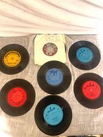 Seven Polish 7" vinyl singles displayed