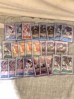 Spread of 25 sleeved One Piece rare holo cards