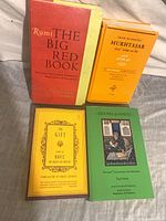 Four books arranged together showing all covers