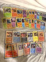 Full spread of approx. 45 holo Pokémon cards laid out