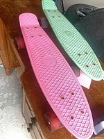 Top view of both skateboards showing deck colors and mounting points