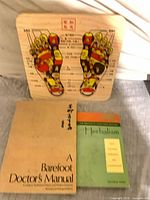 Full lot showing board and two books