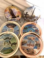 All six plates arranged for scale and finish comparison