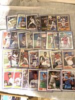 Wide view of sleeved Topps baseball insert cards laid out