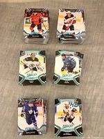 Six visible stacks of MVP hockey cards showing front player images