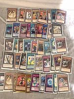 Spread of sleeved Yu-Gi-Oh cards showing mix of Monster, Spell, Trap and Extra Deck types