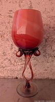 Full view of pedestal bowl showing peach-pink swirl cup and twisted stem