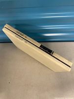 Spine view of both yearbooks showing titles ’75 and ’76