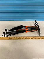 All three garden hand tools nested together showing heads and handles