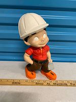 Front view of figurine standing upright