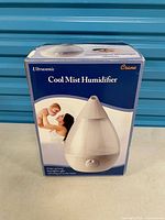 Front of Crane cool mist humidifier box showing product image
