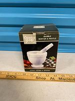 Front view of boxed Creative Home marble mortar and pestle set