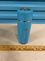 Full view of blue Santevia water bottle standing upright