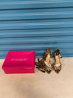 Sandals and box side-by-side