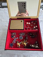 Interior view showing jewelry pieces and speaker grille