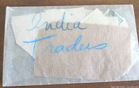 Paper sleeve marked 'India Trades' containing stamps