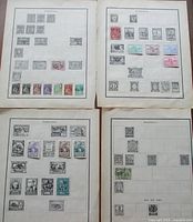 Overview of four album pages showing Portugal and Rhodesia stamps