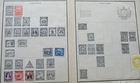 Two Salvador album pages with mounted stamps