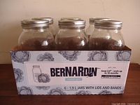 Front view of six Bernardin jars in original box