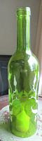Full view of green glass wine bottle candle holder