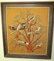 Front view of framed crewel embroidery showing entire artwork