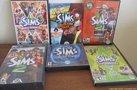 Front view of all six Sims game cases
