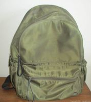 Front view showing overall design and front zip pocket