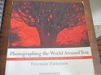 Front cover displaying title, author, red tree graphic, softcover format